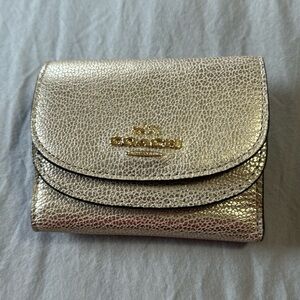 Gold pebble leather Coach wallet